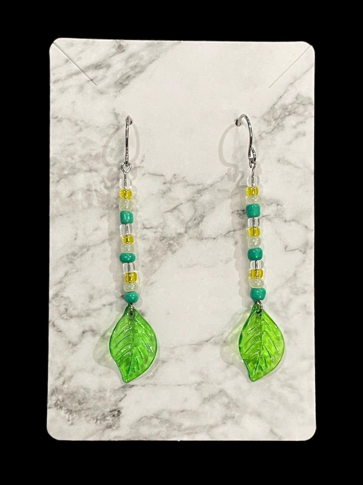 Dainty Leaf Dangle Earrings Made with Hypoallergenic Stainless Steel Hooks and Acrylic/Seed Beads.